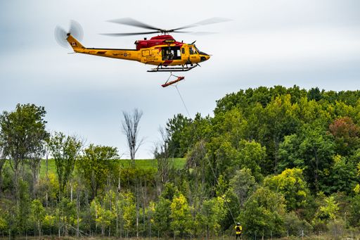A Royal Canadian Air Force military helicopter hovering during an air show in Gatineau, Quebec, Canada