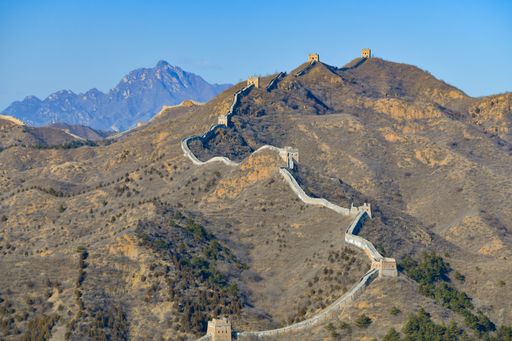 The part of the Great Wall of China built on the mountains against the blue sky
