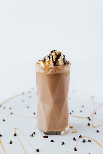A vertical shot of the banana chocolate milkshake