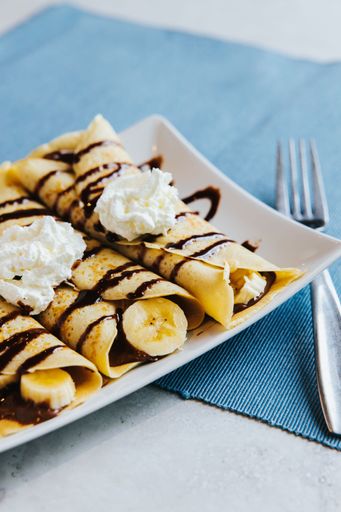 A vertical shot of Banana Chocolate Crepes