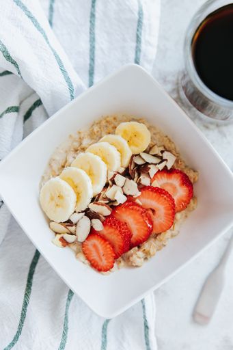 A vertical shot of overnight oats with fruits