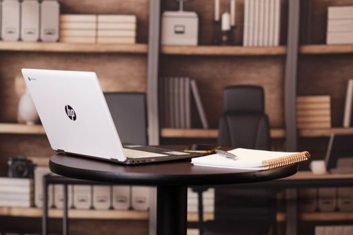 An HP Chromebook laptop on a desk workspace