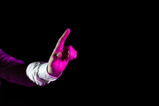 Hand Of Male Professional Pointing And Gesturing While Training Through Virtual Reality Simulator. Man Finger Presenting Futuristic Technology.
