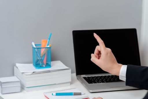 Businesswoman Pointing With One Finger On Messages. Executive In Suit Presenting Crutial Information. Woman Showing Critical Announcements.