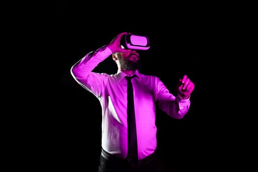 Businessman Wearing Headset Holding Pen While Training Through Wearing Virtual Reality Simulator. Man Presenting Futuristic Technology.
