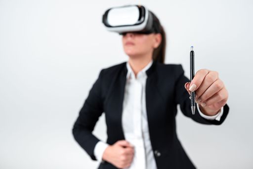 Woman Wearing Vr Glasses And Pointing On With Pen. Businesswoman Having Virtual Reality Eyeglasses And Presenting Idea. Executive Showing Late Data.