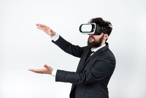 Man Wearing Vr Glasses And Presenting Messages Between Hands. Businessman Having Virtual Reality Eyeglasses And Showing Crutial Information.