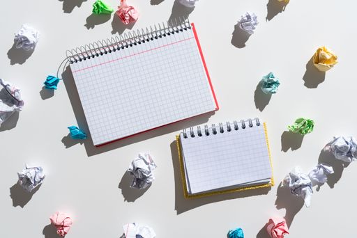 Notebooks With Messages Surrounded By Paper Wraps. Crutial Announcements On Notepads With Crumpled Notes Around. Recent Ideas Presented On Notes.