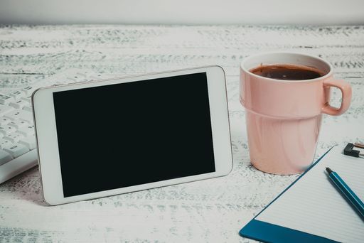Mobile Phone Screen With Messages On Desk With Coffee And Keyboard. Crutial Information On Cellphone On Table With Cup. Late Updates Presented.