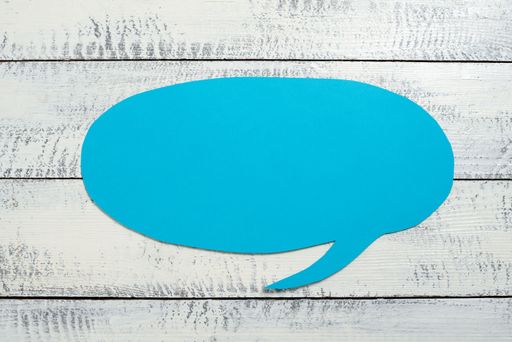 Speech Bubble On Floor With Information Written In. Dialogue Balloon On Ground With Crutial Announcement Inside. Idea Presented In Shaped Form.