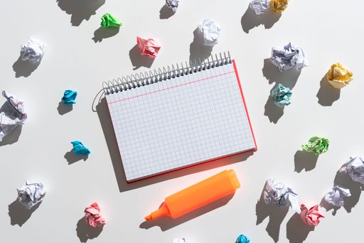 Notebook With Messages Surrounded By Paper Wraps And Marker. Crutial Announcement On Notepad With Crumpled Notes Around. Ideas Presented On Note.