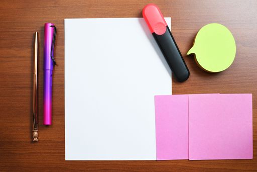 Messages Written On Piece Of Paper And Sticky Notes On Desk With Pens. Crutial Information Presented On Worksheets. Critical Announcements Displayed.