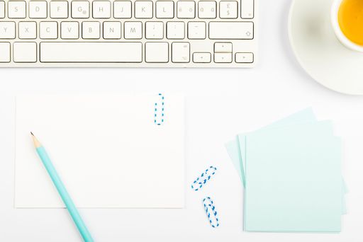 Important Announcements On Piece Of Paper On Desk With Memos, Pen, Hot Drink And Keyboard. Crutial Ideas On Note On Table With Pencil And Cup Of Tea.