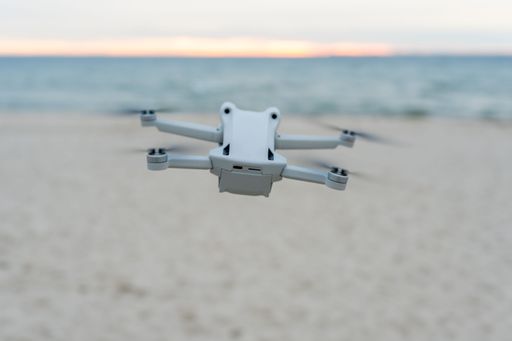 A drone hovering on the beach