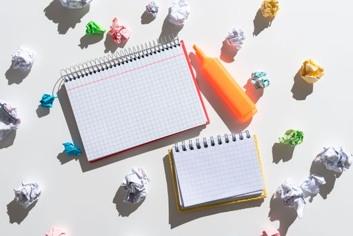 Notebooks With Messages Surrounded By Paper Wraps And Marker. Crutial Announcements On Notepads With Crumpled Notes Around. Ideas Presented On Notes.