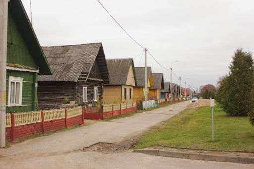 Gierviaty. Private houses of different colors in a cloudy day