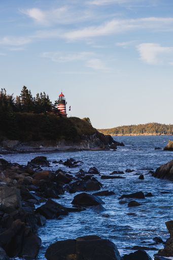 the Quoddy Head Lighthouse in Maine seen from a distance