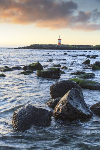 A vertical shot of lighthouse Puerto Baquerizo Moreno Mann beach in The Galapagos Islands