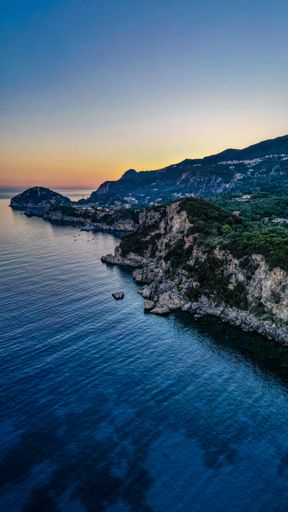 A vertical shot of Palaiokastritsa during the day in Corfu, Greece