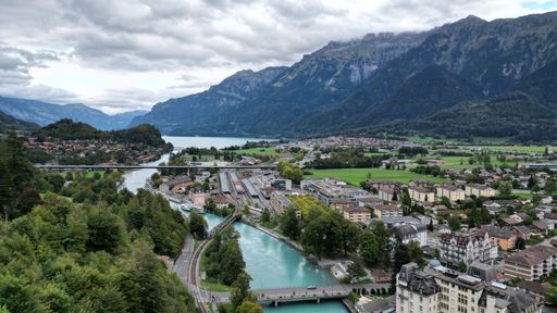 The view of a small town surrounded by mountains. Interlaken, Switzerland.