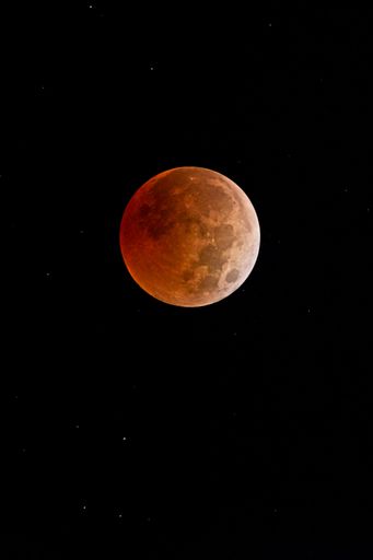 A full moon in night sky during Lunar Eclipse
