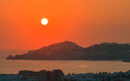 An aerial view of the beautiful bright sunset over the Manzanillo beach, Mexico