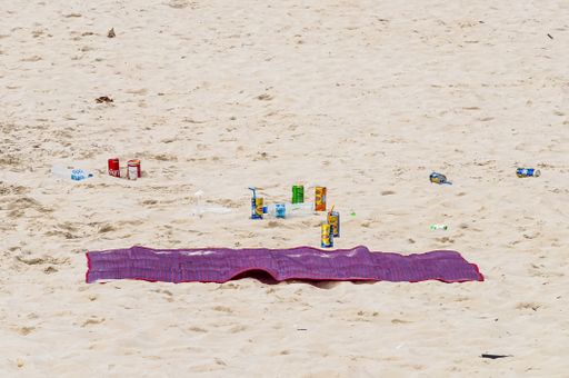 Waste left behind by tourists on the beach