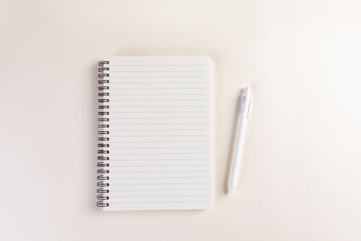 A closeup shot of a notepad and a pen