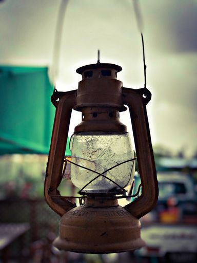A vertical shot of an old vintage lantern