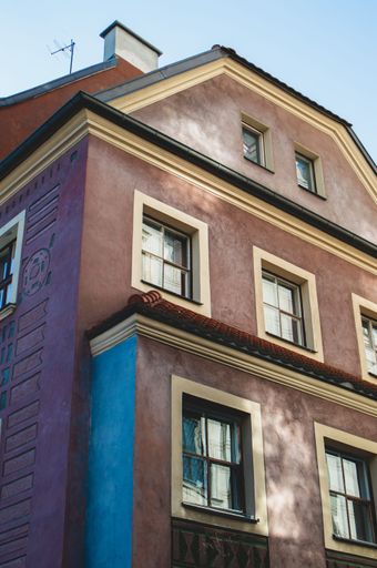 A low-angle shot of a big house in Poznan, Poland