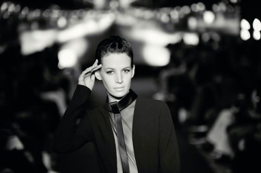 An grayscale portrait of an attractive model during the African fashion up show in hotel Salomon Paris