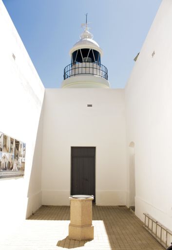 A vertical shot of a white building in the Serra Gelada Natural Park, Spain