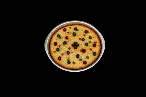 Top View of Rava Cake in Cake Pan with Berry, Cherry, Tuti Futi, Isolated on Black Background