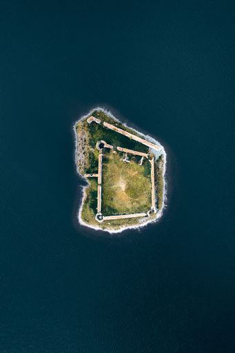 A drone view of the scenic Lochindorb Castle on an island within a lake