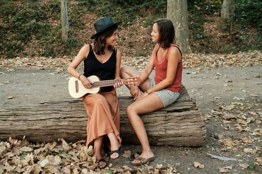 Spanish lesbian couple sitting in nature