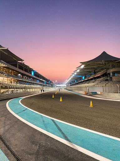 The Yas Marina Circuit Formula One racing track on Yas Island at night when it is open for use by cyclists, runners and walkers