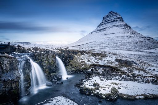 A beautiful shot of Mount Kirkjufell with icy waterfalls during winter in Iceland