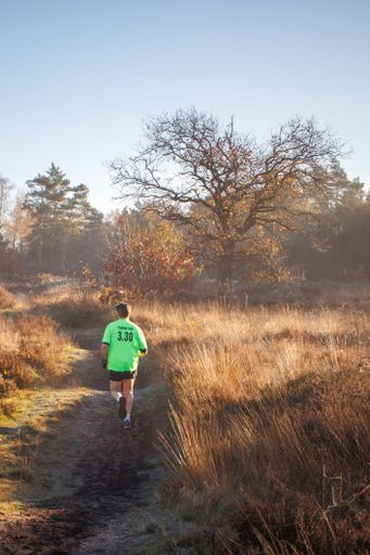 Solo runner having his morning run in the rising sun