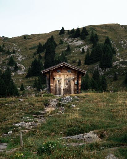 A rustic toilet house on a Swiss mountain in Lauterbrunnen, Switzerland