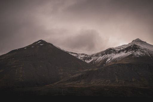 A scenic view of the Reykjavik mountain landscape in Iceland under a cloudy sky