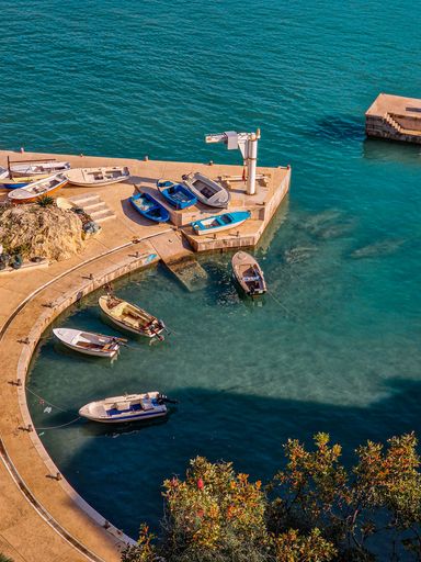 A verical shot of a harbor with boats in Ulcinj, Montenegro