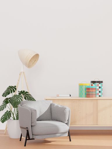 A 3D rendering of a living room with a white wall gray sofa and wooden sideboard