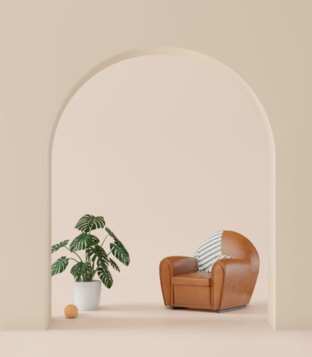 A 3D rendering of a living room with an earth tone, a big curve door, and a leather sofa