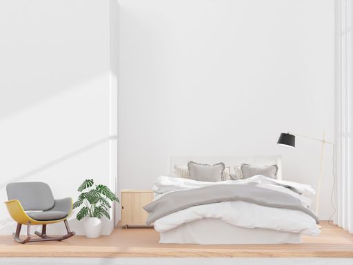 A 3D rendering of a living room with a white wall little chair and sideboard