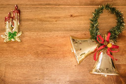 A top view of Christmas decorations on a wooden table with copy space