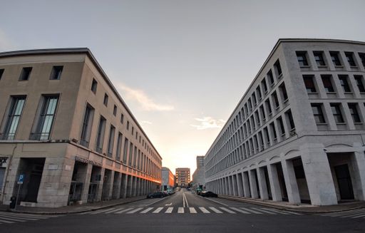 A low angle of EUR residential and business district with empty streets at sunset in Rome, Italy