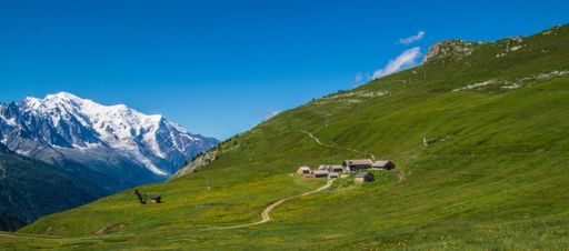 A landscape scene of green hills and rural houses in charamillon gondola alps in Haute Savoie, France