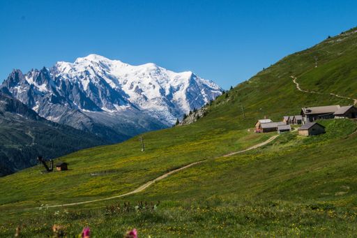 A landscape scene of green hills and rural houses in charamillon gondola alps in Haute Savoie, France