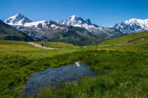 A landscape of lake on grass meadow in charamillon gondola snowy alps in Haute Savoie, France