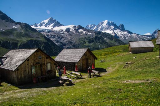 A landscape scene of rural houses on green hills in charamillon gondola alps in Haute Savoie, France